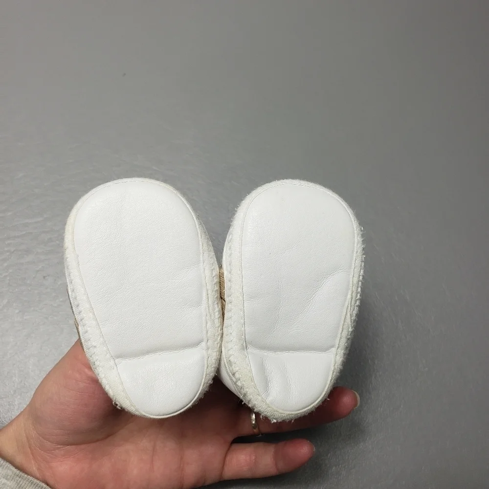 unbranded newborn white and brown gender neutral monkey shoes/slippers